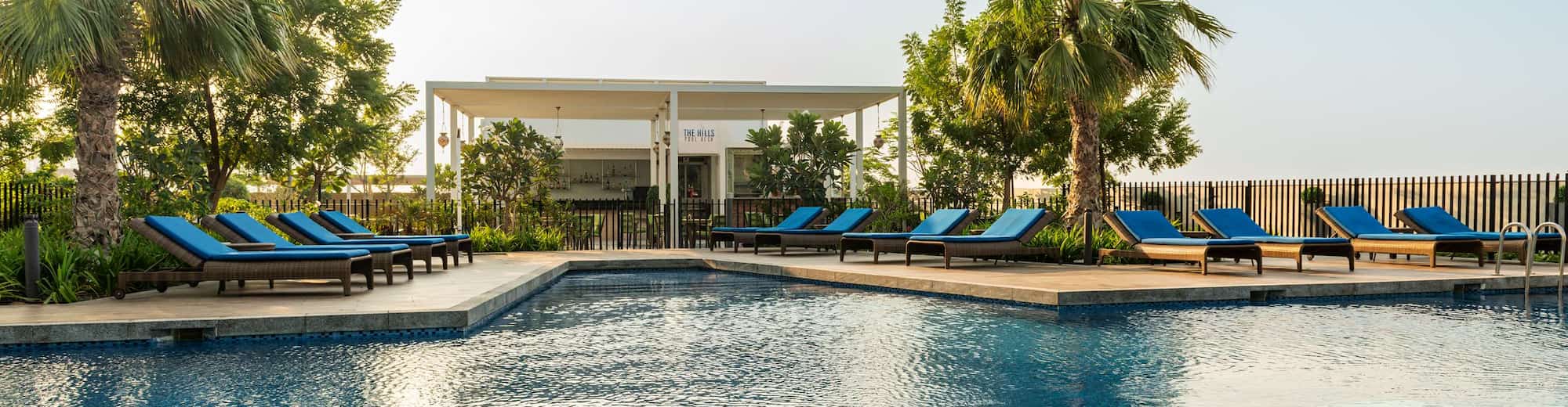 Radisson Hotel Dubai Damac Hills - Hills Pool Deck - Pool & Restaurant view