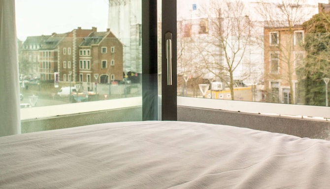 Radisson Hotel Liege City Centre - Superior Room balcony view from bed