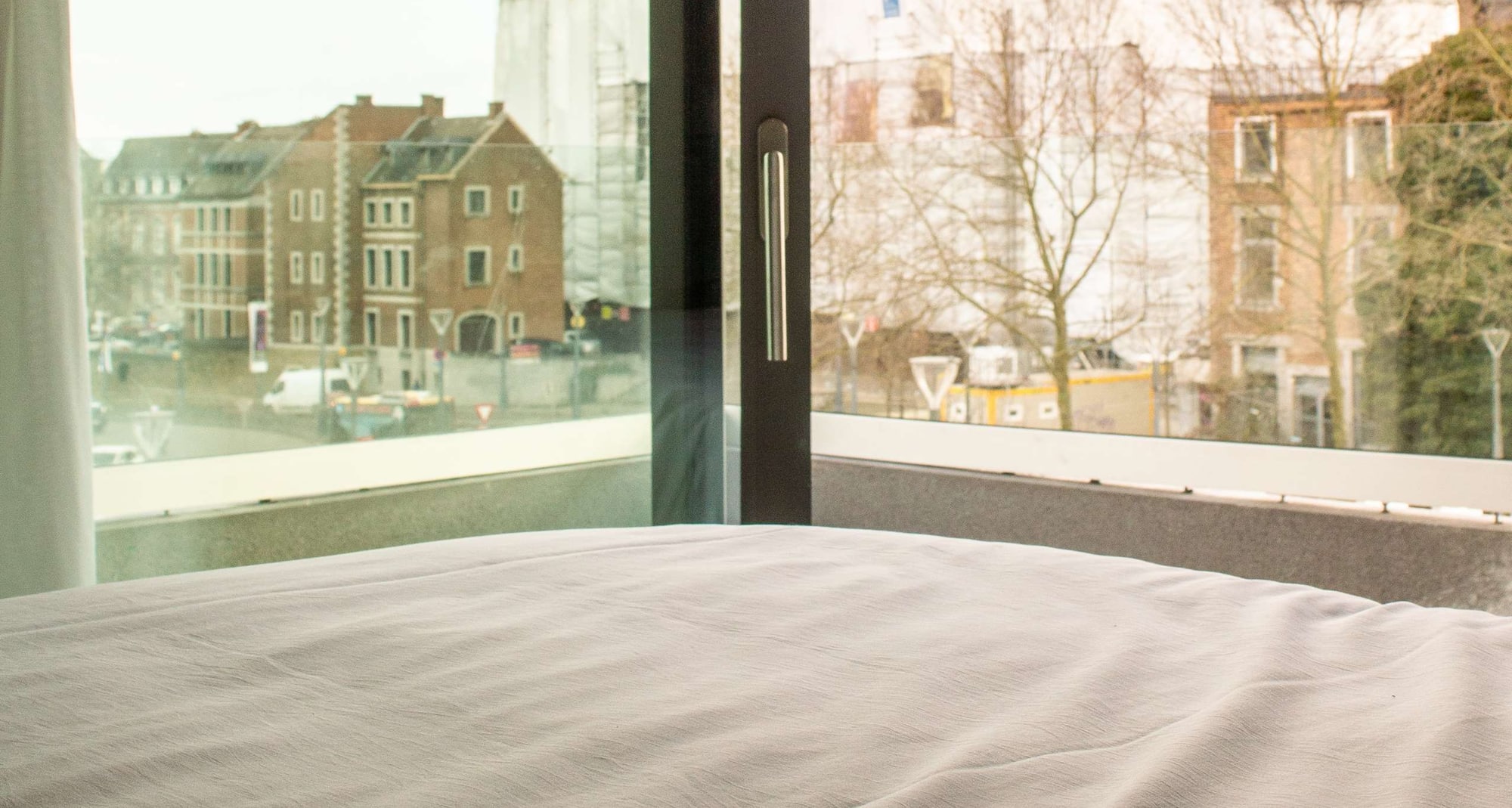 Radisson Hotel Liege City Centre - Superior Room balcony view from bed