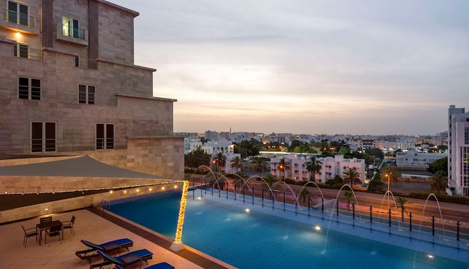 Radisson Hotel Muscat Panorama - Pool Dusk