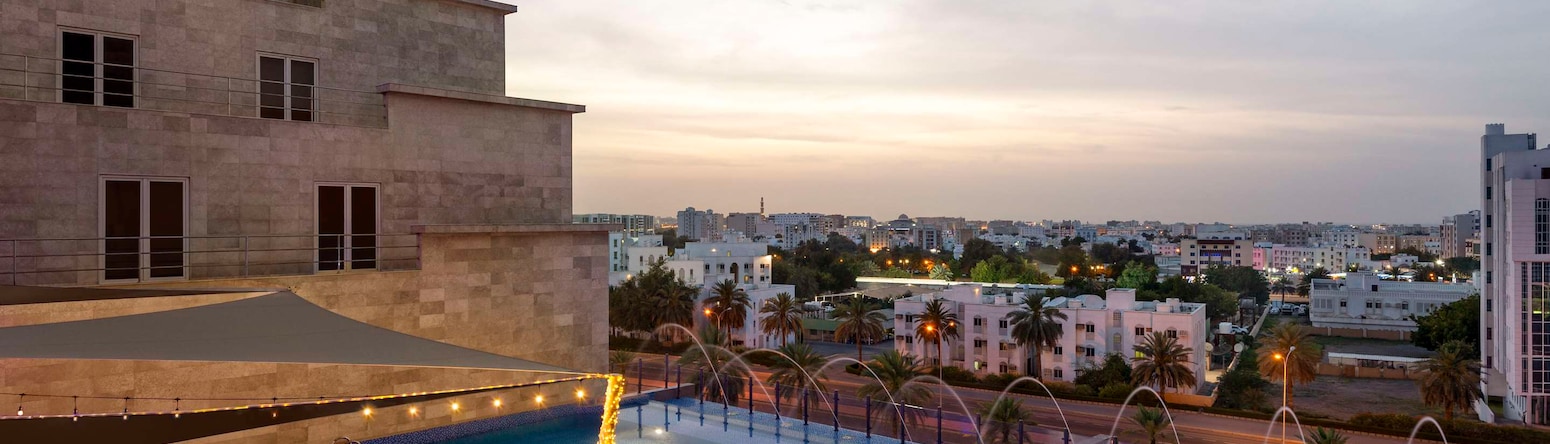 Radisson Hotel Muscat Panorama - Pool Dusk