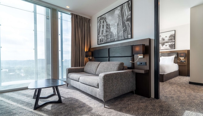Radisson Hotel & Suites, Amsterdam South - One Bedroom Suite - Living Room