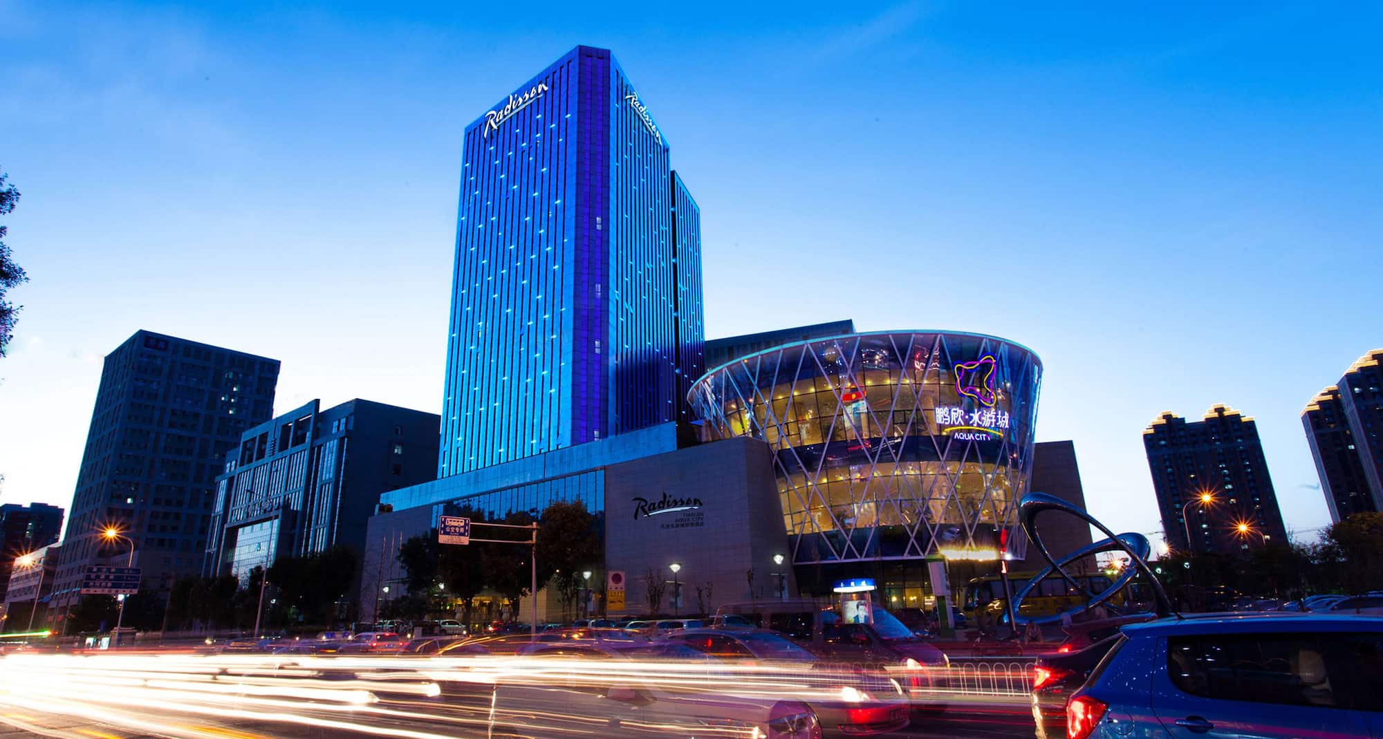 Radisson Hotel Tianjin Aqua City - Exterior by night
