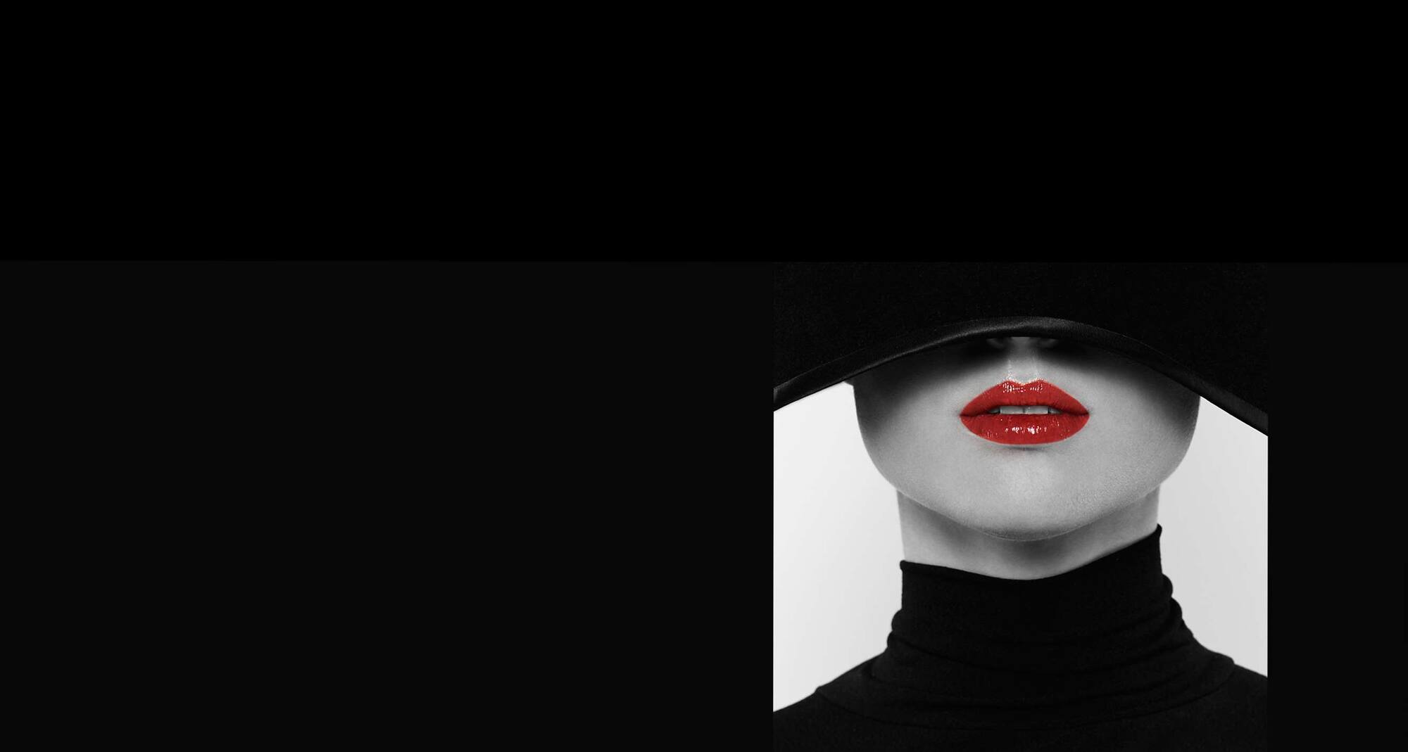 Artful woman with red lipstick, black top with a white chest piece