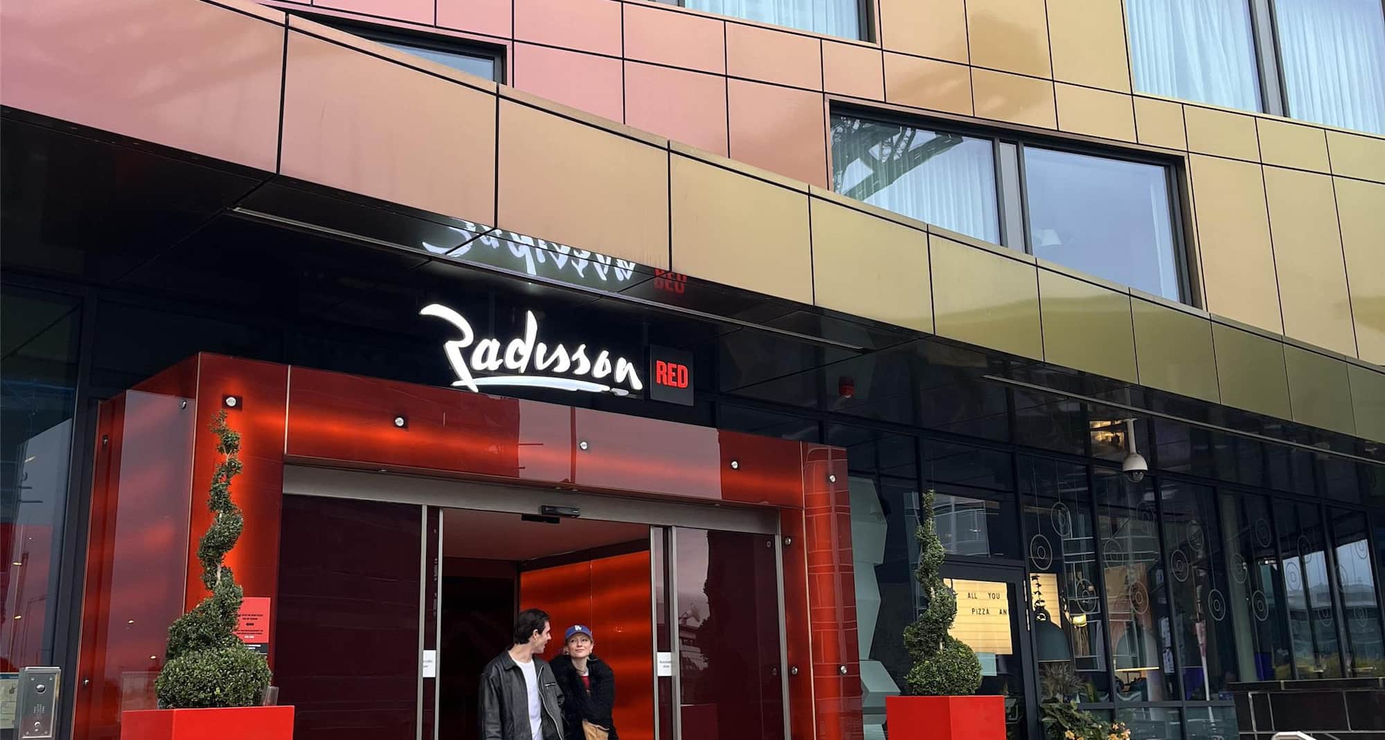 Radisson RED Glasgow - Couple leaving hotel