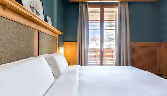 Radisson Residences Savoia Palace Cortina d'Ampezzo - Suite bedroom