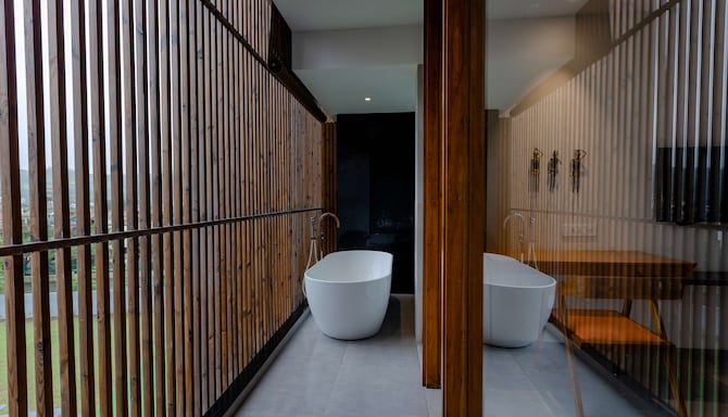 Radisson Resort and Spa Lonavala - Deluxe Room bathroom with bathtub