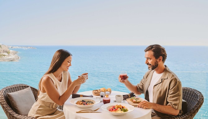 Radisson Rewards Brand - Couple enjoying Free breakfast for 2 Radisson Rewards