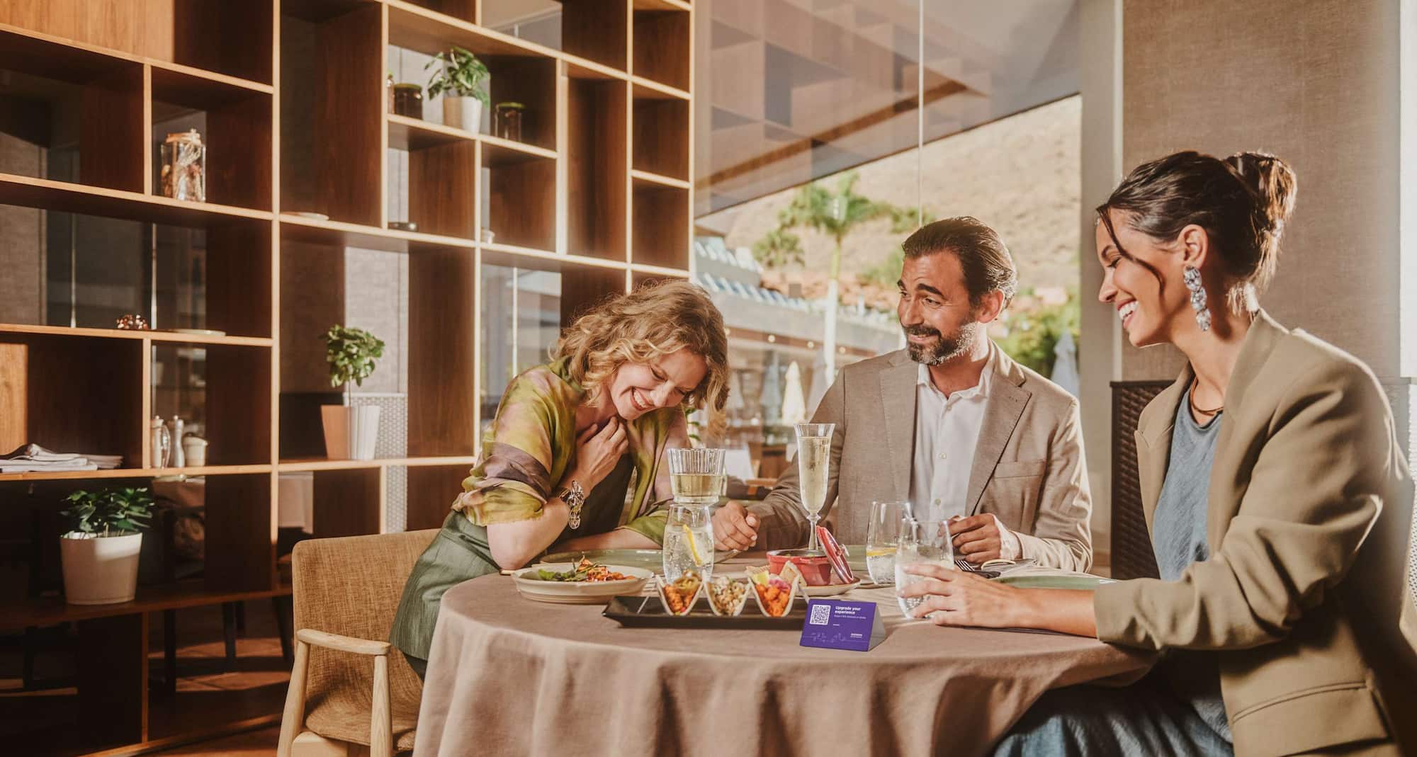 Radisson Rewards Brand - Young people dining with alcohol