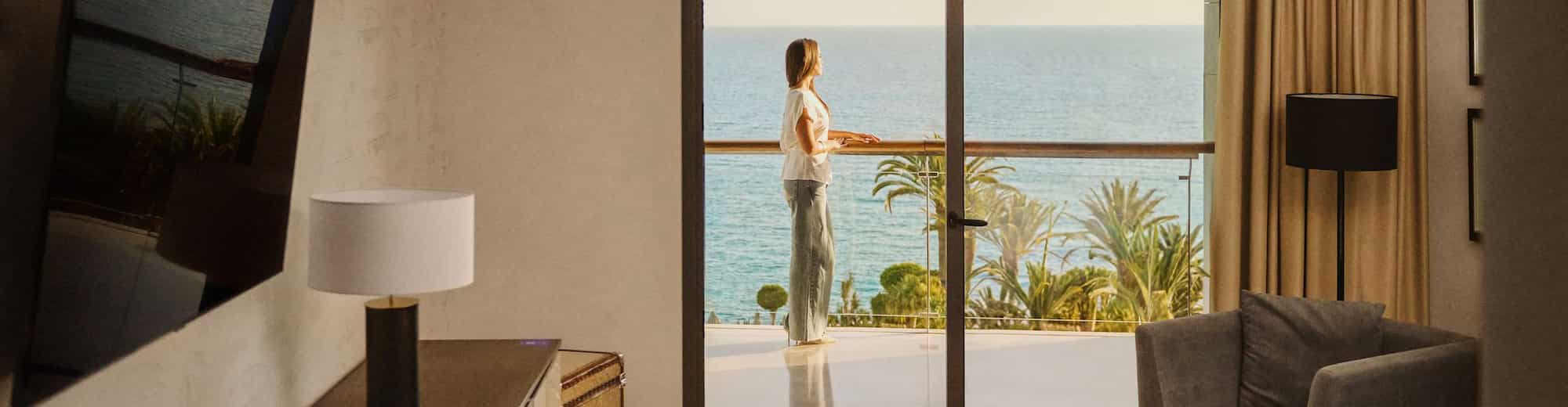 Radisson Rewards Brand - Member enjoying the view from the room