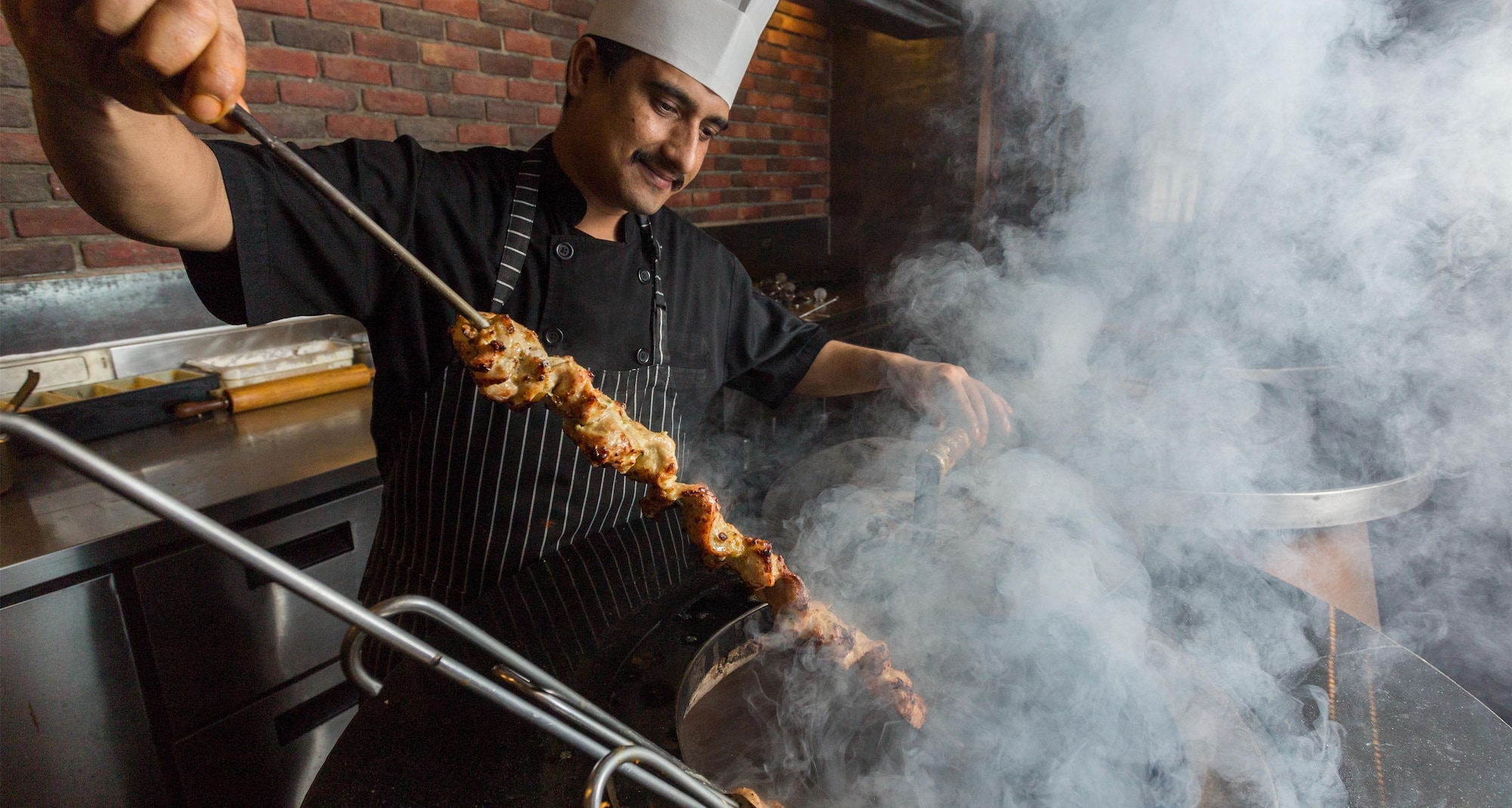 Radisson Suites Bangkok Sukhumvit - Punjab Grill | Grilling skewers