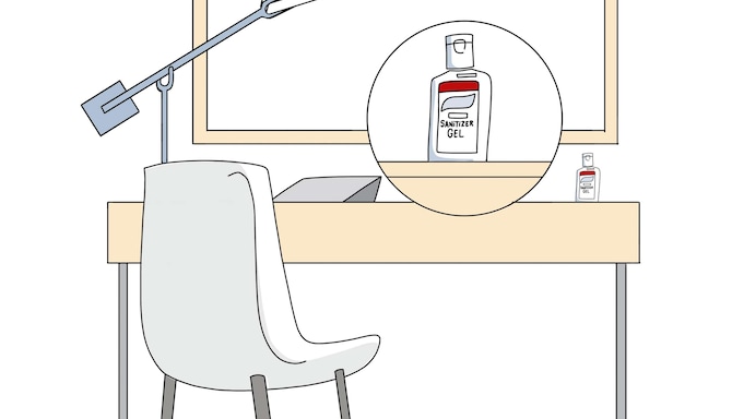 Un’illustrazione disegnata di una scrivania in una camera con un flacone di disinfettante per le mani