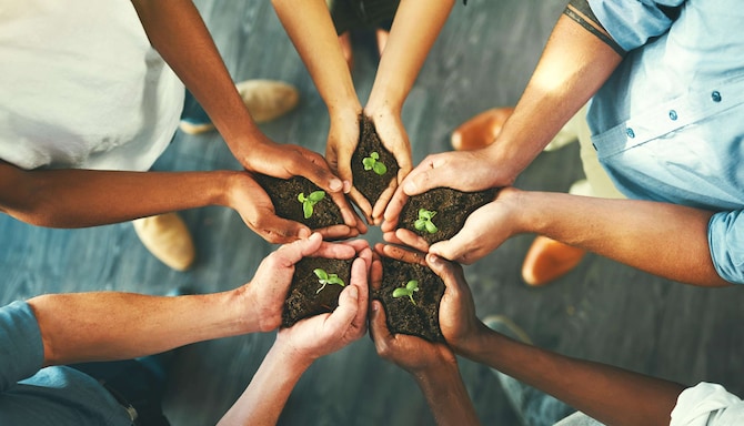 Responsible Business - People holding earth