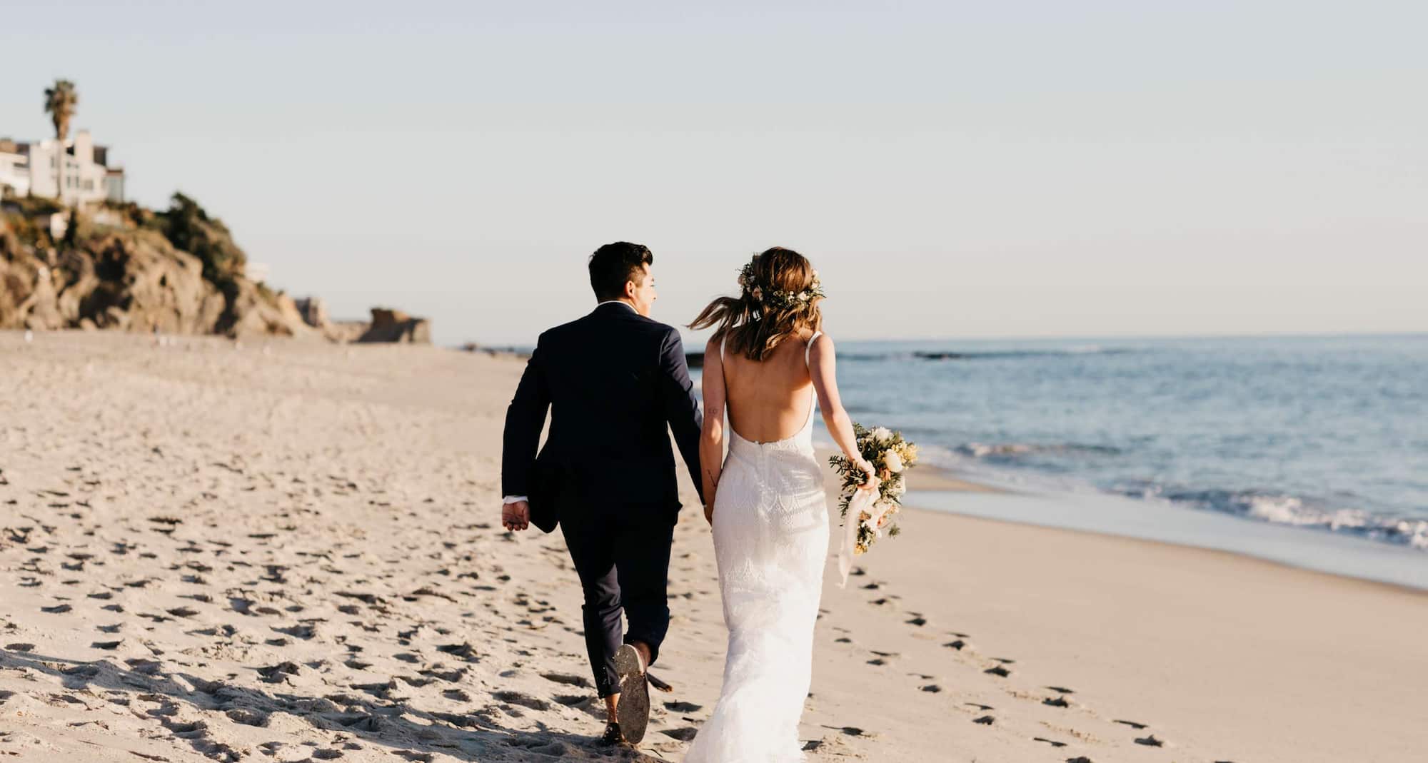 Weddings - Couple walking on beach