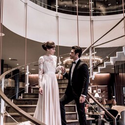 Weddings - Bride and Groom on interior stairs