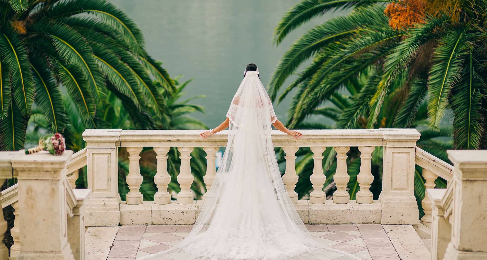 Weddings - Bride looking over garden