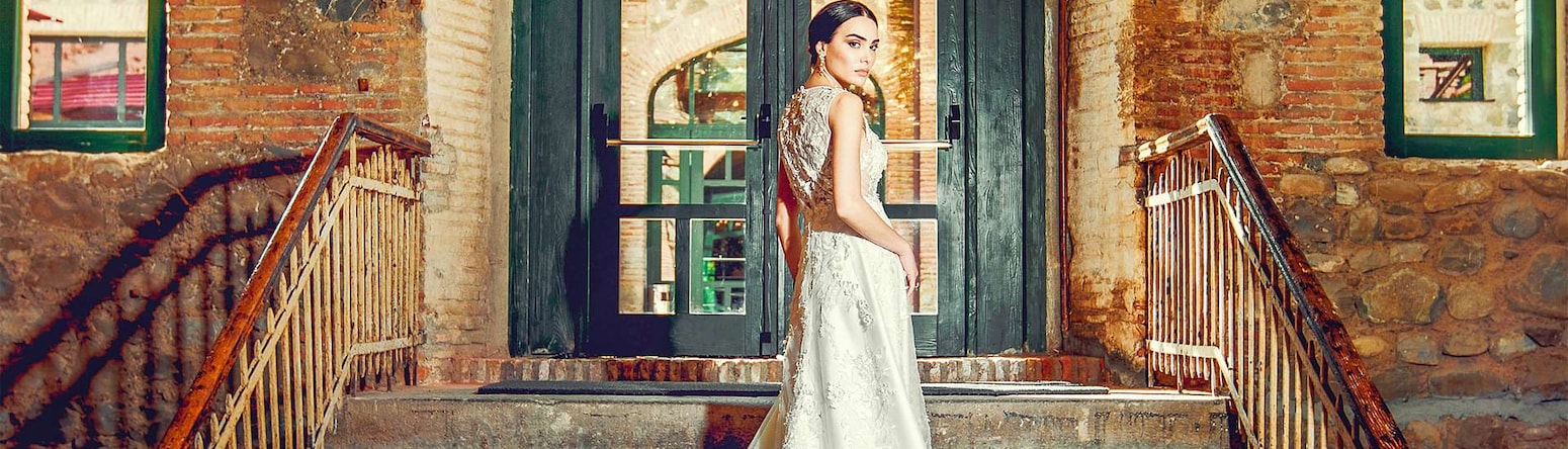 Weddings - Bride walking up interior stairs